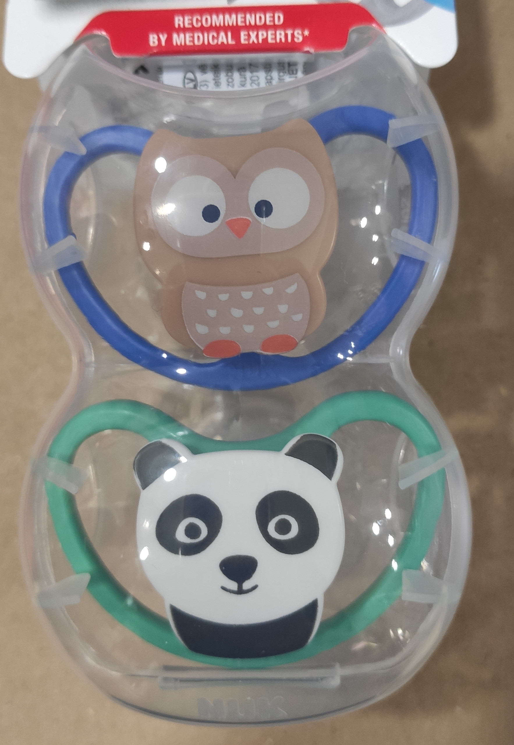 SU32 NUK Space silikona māneklītis 6-18mēneši 2gb.